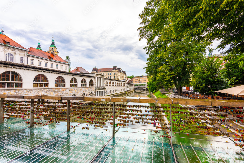 Bridge in Ljubljana city, with locks as symbol of love. Romantic tradition in Slovenia capital.