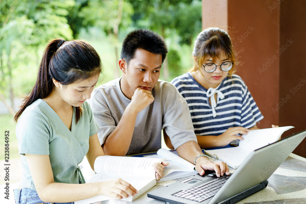 High school students; Group of happy teen Asian high school students outdoors; Group of cheerful the homework at school. High school students; Group of happy teen Asian high school students outdoors; Group of cheerful the homework at school.