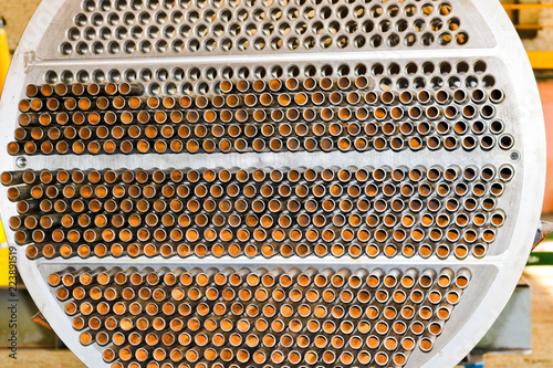 Production of a large tube bundle for a shell-and-tube heat exchanger in an industrial production room of a shop with equipment at an oil refinery, petrochemical, chemical plant, enterprise