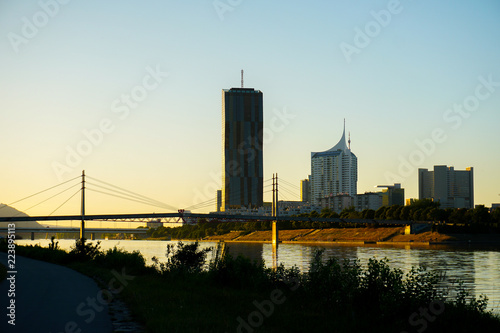 View of Wien and Danube river. Concept of cityscape and sunset in Austria. photo