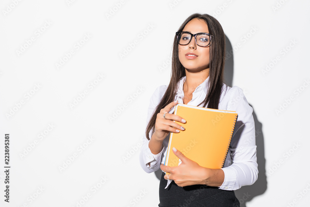 Young business woman with notebook isolated on white background Young business woman with notebook isolated on white background