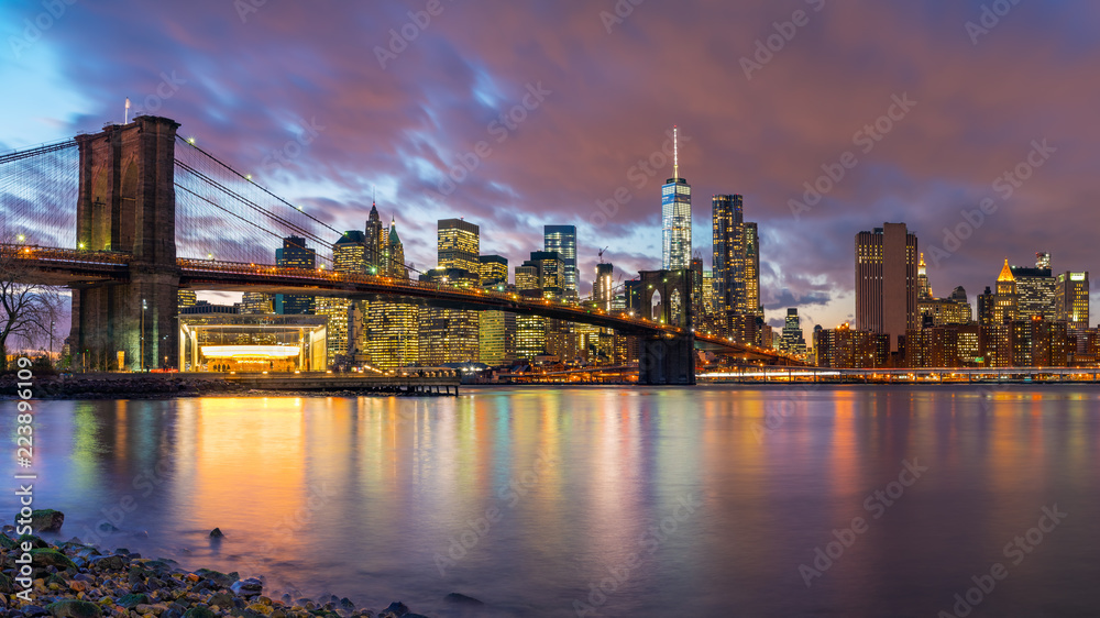Brooklyn bridge and Manhattan after sunset, New York City