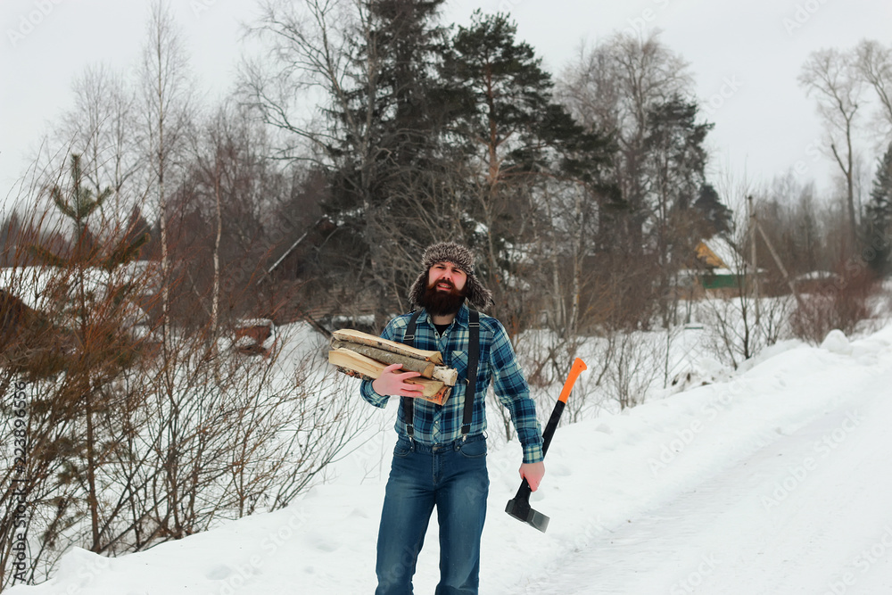 man in winter with axe