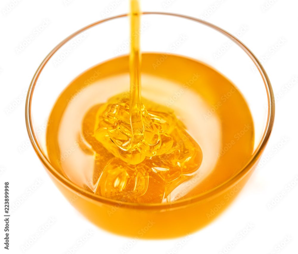 Honey pouring and glass jar isolated on white background. Organic bee products.. Honey pouring and glass jar isolated on white background. Organic bee products..