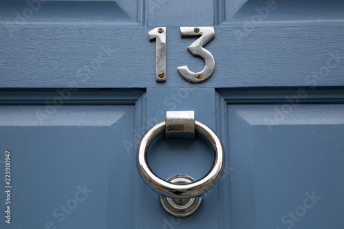 Fotografie Thirteen Number on Blue Door