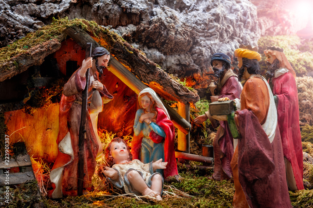 Christmas nativity scene with Holy Family in the hut and the three wise ...