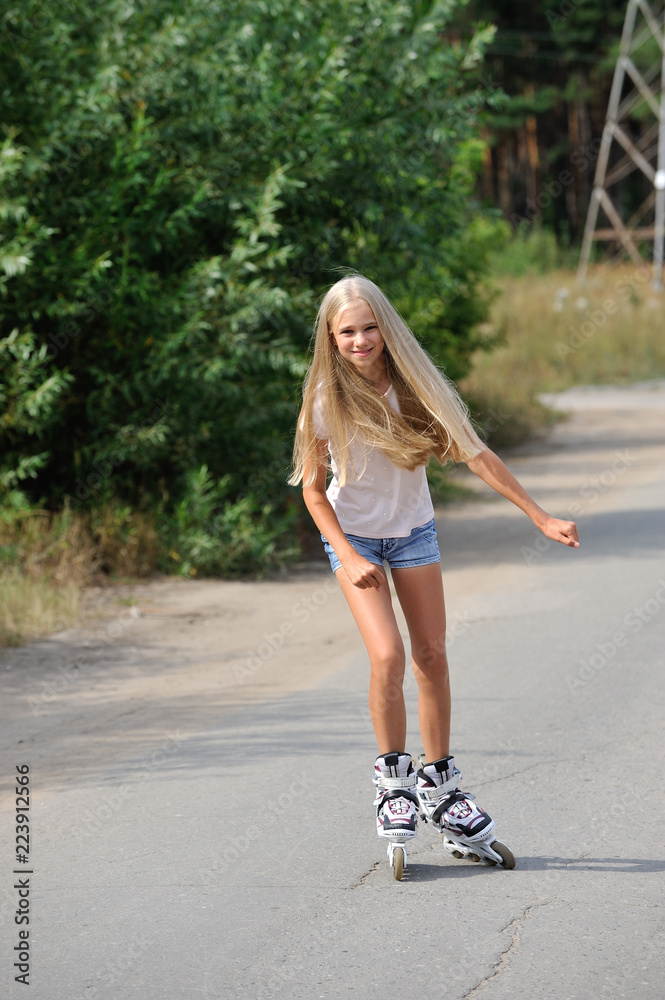 The girl rides on roller skates