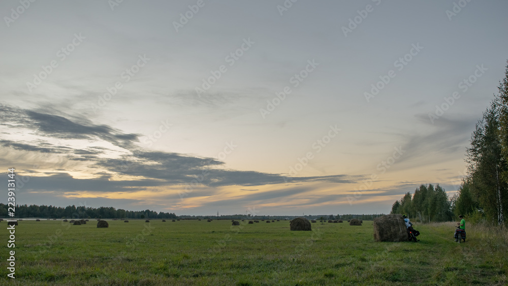 Bicyclists in the field in Russia