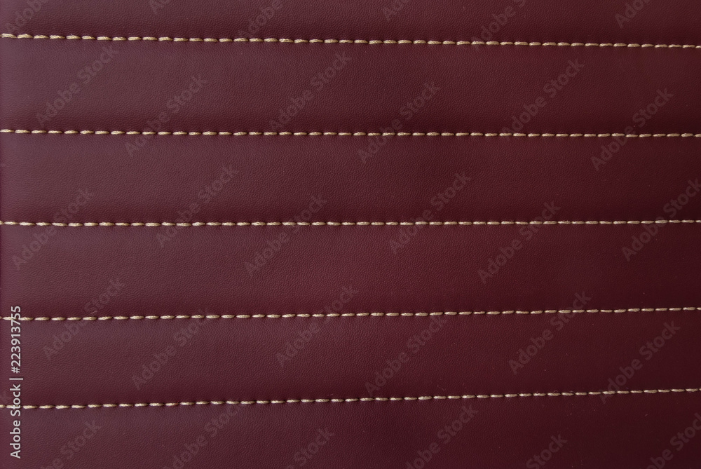 red leather Mat with straight stitching soft leather machine foot textured pattern collection concept background fabric business