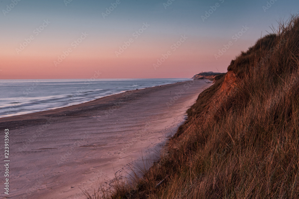 Coastline panorama view with endless beaches and giant grass sand dunes at the northern danish sea. Løkken in North Jutland in Denmark, Skagerrak, North Sea