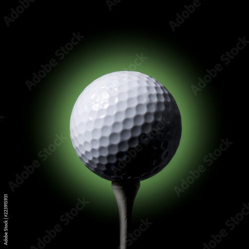 Golf ball on Tee black background