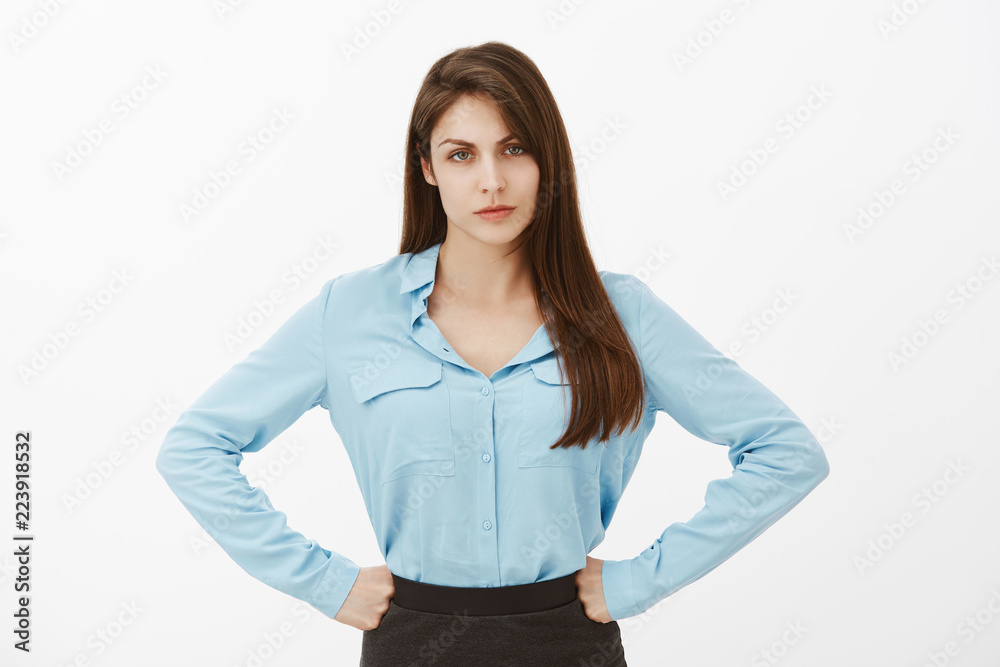 How could you disappoint me. Displeased unhappy european female in blue blouse, holding hands on hips and frowning, being disappointed or offended, complaining, blame colleague for bad work How could you disappoint me. Displeased unhappy european female in blue blouse, holding hands on hips and frowning, being disappointed or offended, complaining, blame colleague for bad work