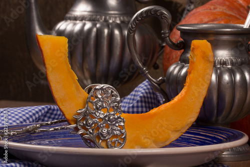 Pumpkin cooking on the kitchen table. Vintage style photo