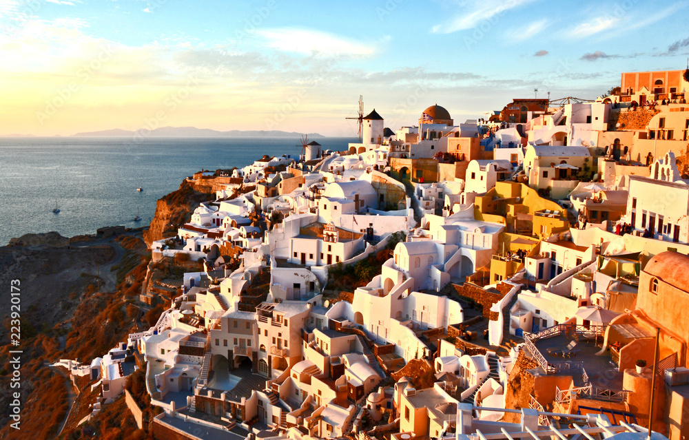 Oia village,Santorini Greece with evening light with blue skye for wallpaper or postcard.