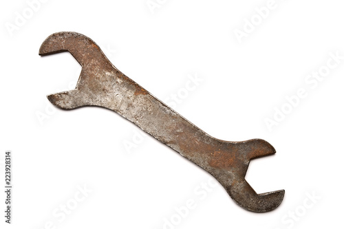 Old wrench isolated on white background.