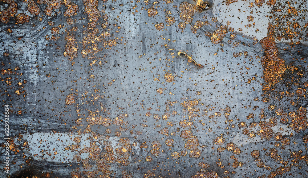 The texture is metallic. Industrial background from an old rusty