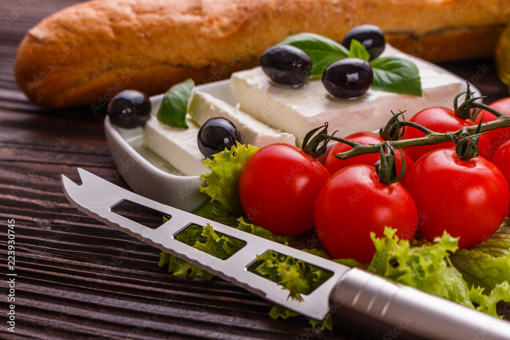 A piece of feta cheese on a wooden rustic background