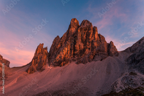 Awesome sunset on Dolomite mountain causing enrosadira effect, South Tyrol, Italy