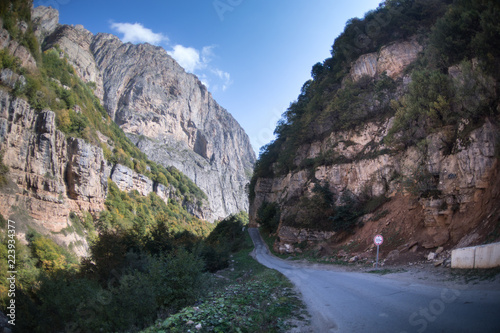 Cycling mountain road. Misty mountain road in high mountains.. Cloudy sky with mountain road. Summertime