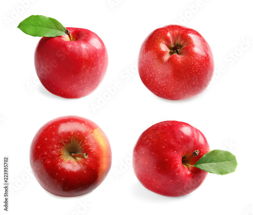 Set with delicious red apples on white background
