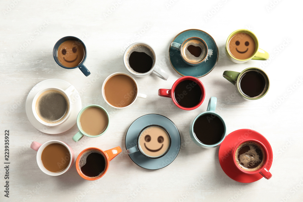 Flat lay composition with cups of coffee on light background. Food photography Flat lay composition with cups of coffee on light background. Food photography