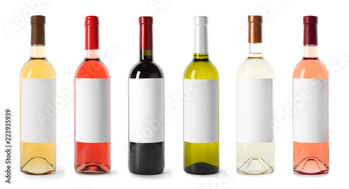 Set with different blank wine bottles on white background. Mock up for design