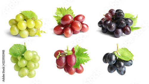 Foto Set with different ripe grapes on white background