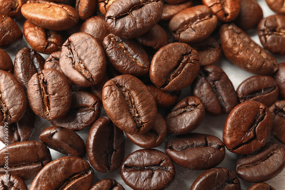 Fototapeta premium Roasted coffee beans as background, top view