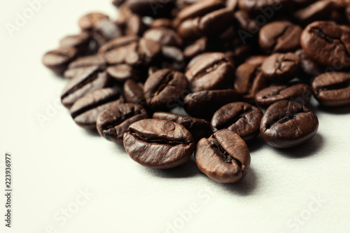 Roasted coffee beans on white background  closeup