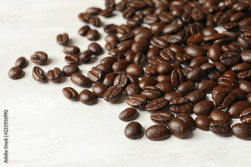 Roasted coffee beans on white background, closeup