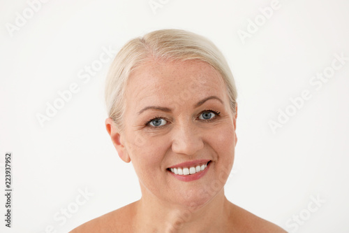 Portrait of beautiful older woman on white background