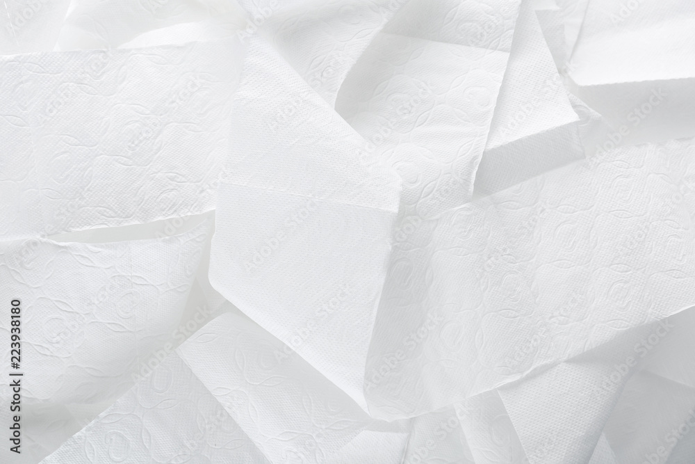 Obraz premium Miękki papier toaletowy jako tło, widok z góry. Higiena osobista