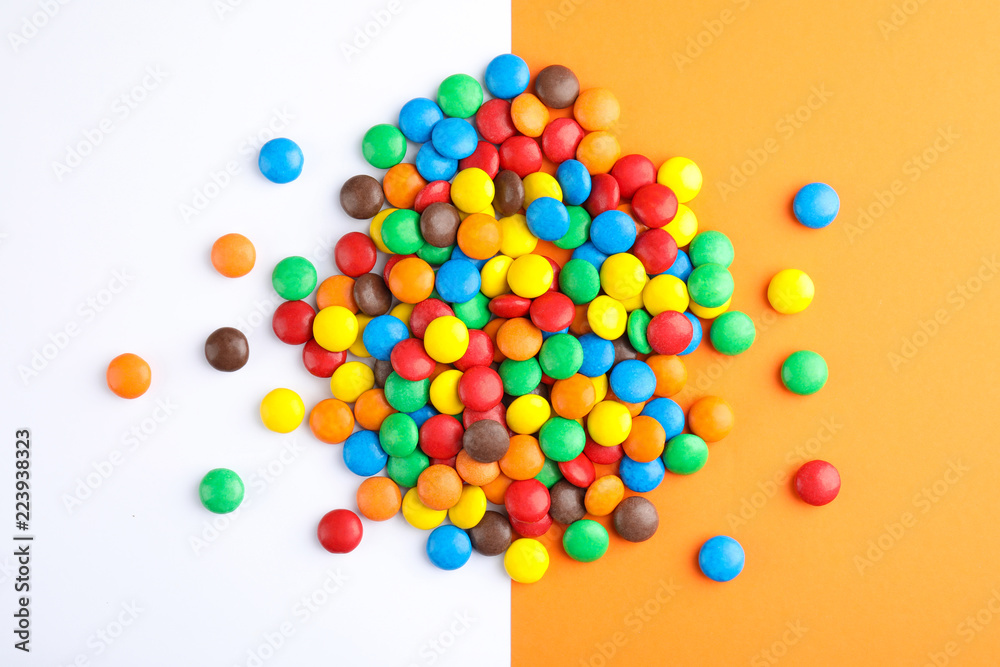 Glazed candies on color background, top view Glazed candies on color background, top view