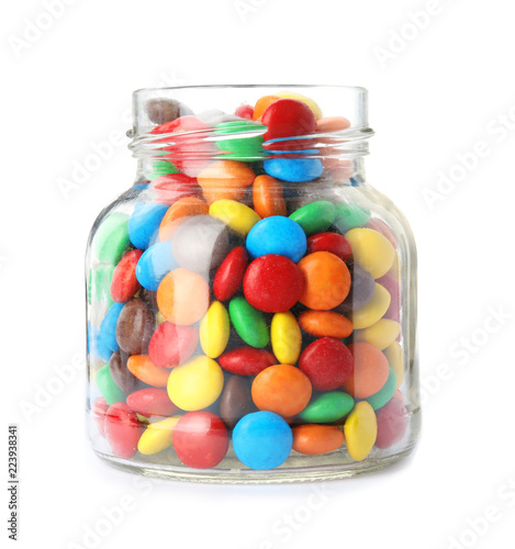 Jar with colorful candies on white background
