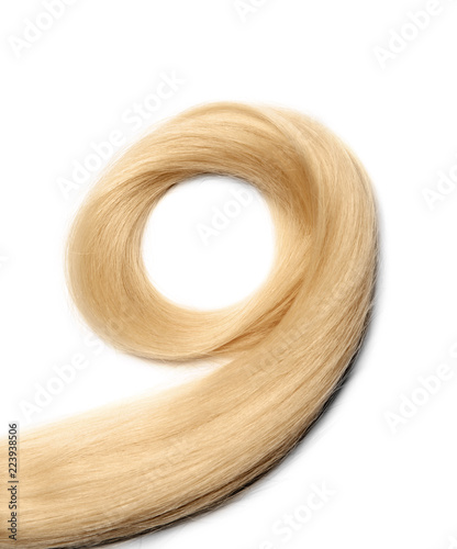 Lock of healthy blond hair on white background