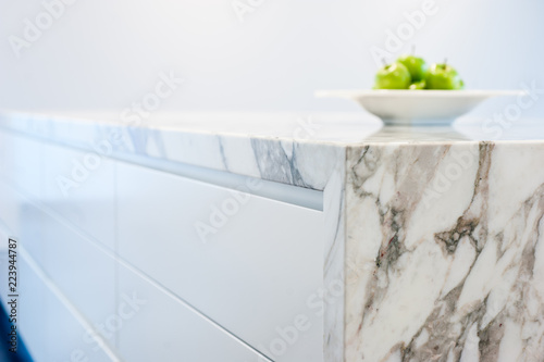 Apples on marble kitchen island bench