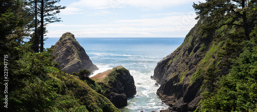 Scenic ocean view through the rocky shore at the Oregon beach, Newport.