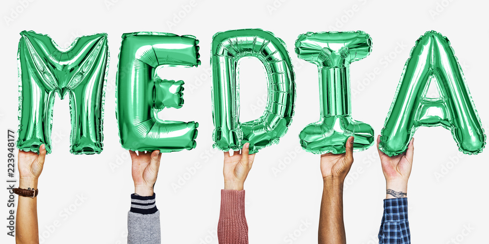 Green alphabet helium balloons forming the text media