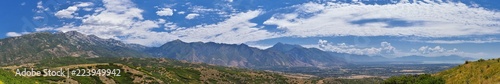 Panoramic Landscape view from Travers Mountain of Provo, Utah County, Utah Lake and Wasatch Front Rocky Mountains, and Cloudscape. Utah, USA.