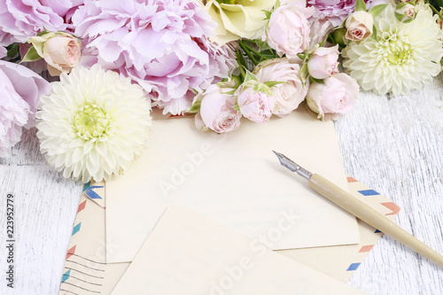Vintage stationery set and pastel colors flowers around