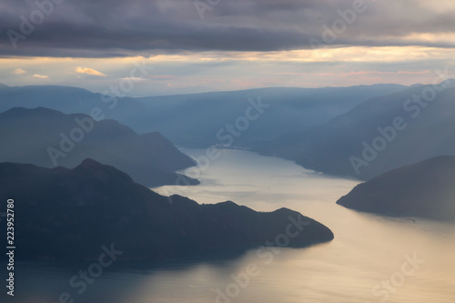 Beautiful aerial view of Howe Sound during a cloudy summer sunset. Taken near Squamish, North of Vancouver, BC, Canada.a