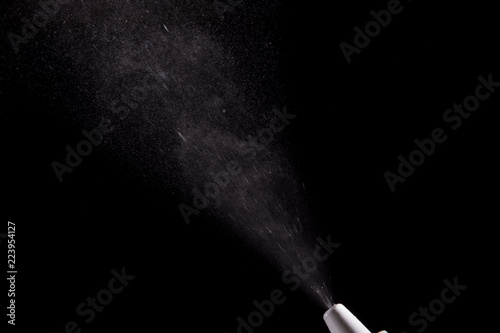 Spray for nose sprayed in the air on a black background