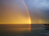 Rainbow over tropical sea ocean and sky