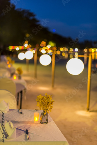 Abstract blur image of Outdoor Cafe or restaurant in night time with bokeh for background usage . (vintage tone)