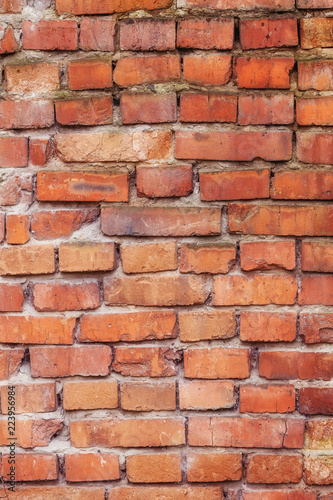 Old red brick wall texture, vertical background