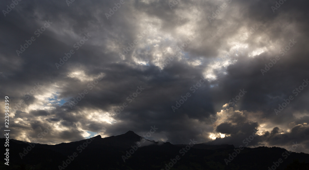 cloudy sky at sunset on mountain