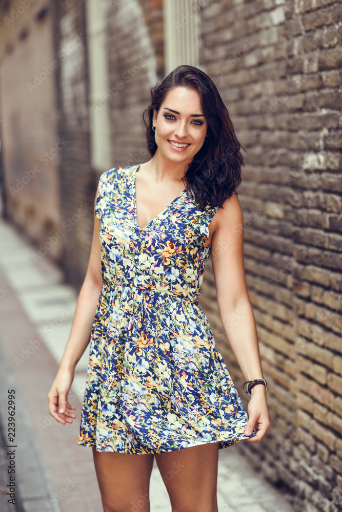 Girl with blue eyes smiling on brick wall. Girl with blue eyes smiling on brick wall.