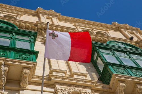 Malta flag, city street and life, urban view and architecture. Travel photo 2018 september.