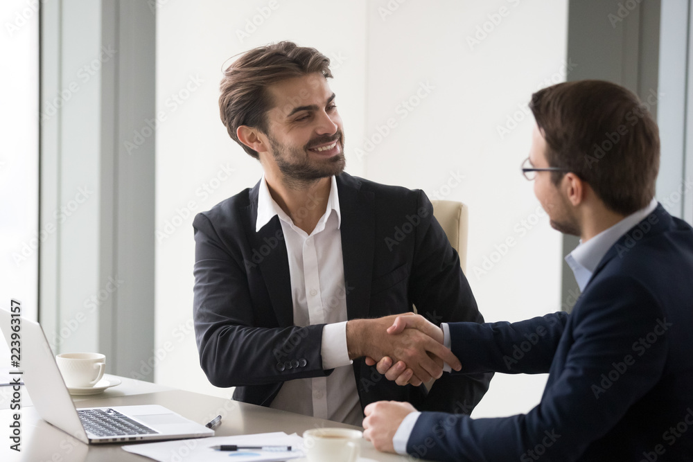 Happy business partners shaking hands after successful negotiations in  office, company CEO handshake colleagues thanking for meeting, businessmen  handshaking closing deal. Cooperation, interview, hr Stock Photo | Adobe  Stock