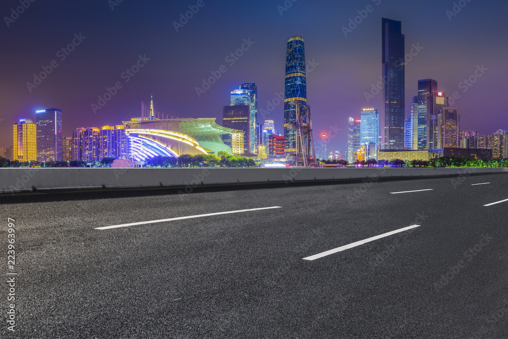 Naklejka premium Road pavement and Guangzhou city buildings skyline